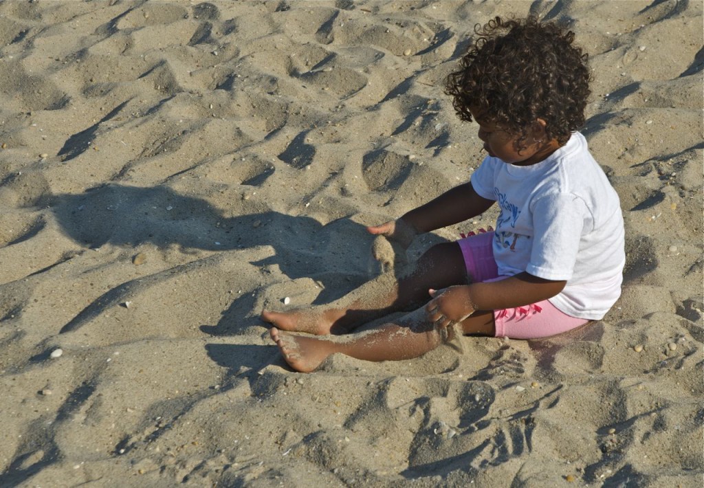 little girl in the sand