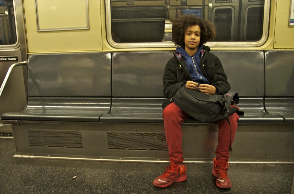 boy-with-red-sneakers-on-subway